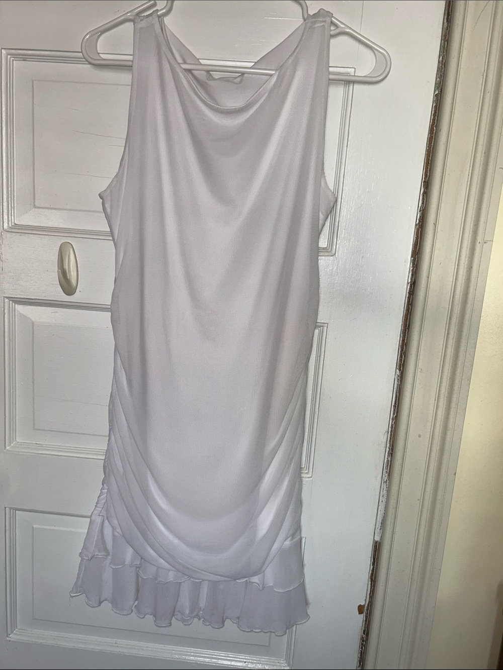 Sleeveless White Drape-Front Mini Dress with Ruffle Hem